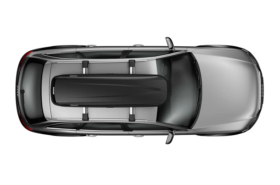 Top view of a silver car with a black Thule Pulse Alpine cargo box mounted on the roof rack for extra storage