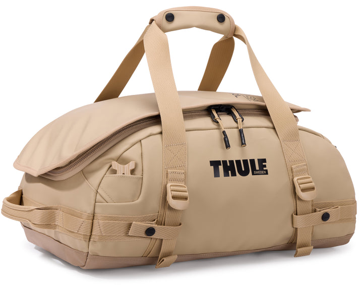 Beige duffel bag with Thule logo on a white background