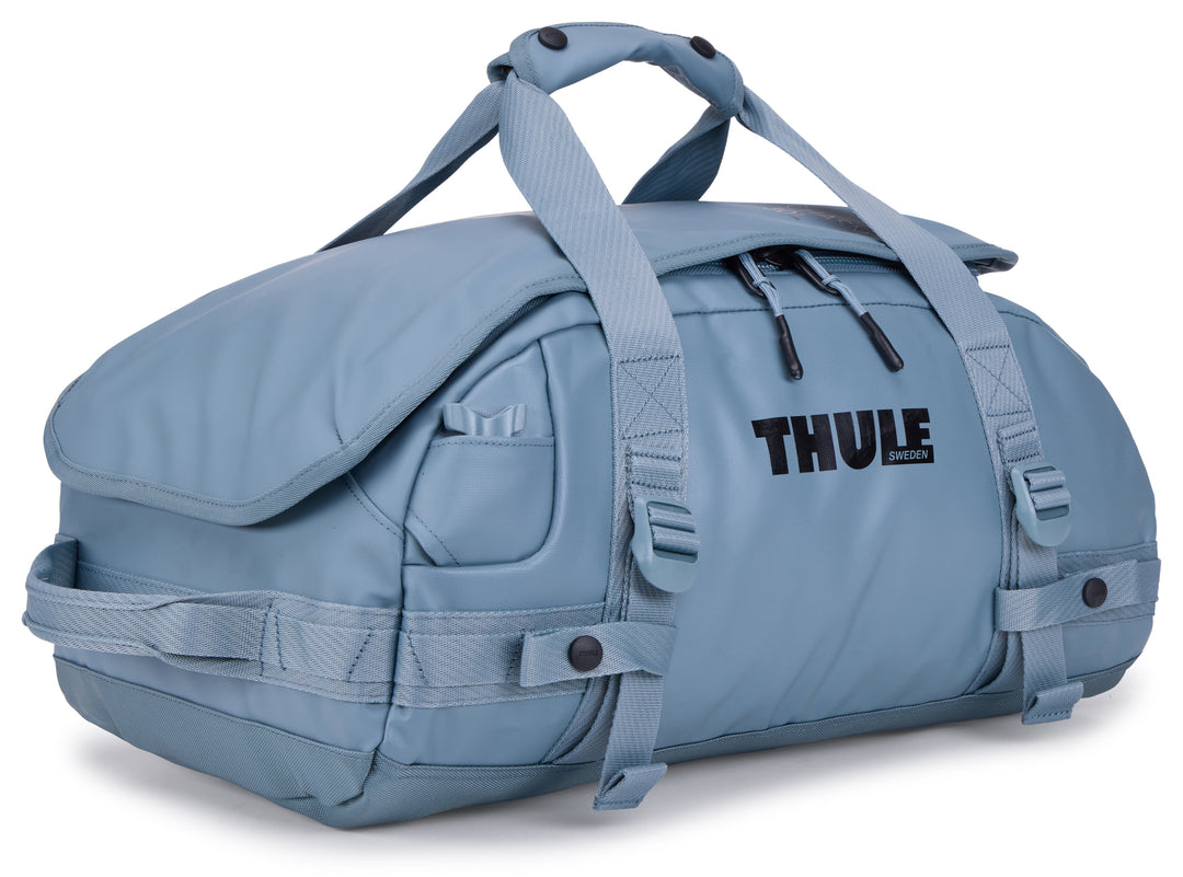Blue duffel bag with Thule logo on a white background
